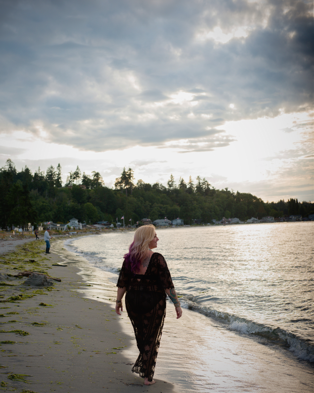 Ellecia Paine walking away on the beach